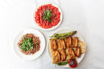 Chicken wings, chicken kebab with grilled vegetables
