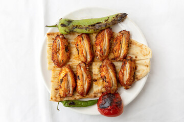 Chicken wings, chicken kebab with grilled vegetables