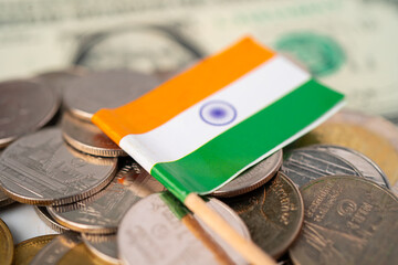 Stack of coins with India flag on white background.