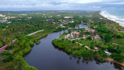 Aerial view of Imbassai beach, Bahia, Brazil. Beautiful beach in the northeast with a river and...