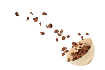 Chocolate corn flakes falling to the white bowl isolated on white. Motion.