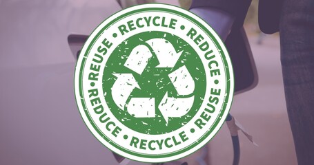 Digital composite of recycling symbol over man charging electric car at station