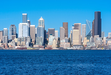 Fototapeta na wymiar Seattle, WA - USA - Sept. 23, 2021: Horizontal view of Seattle's downtown skyline and waterfront; highlighting the Columbia Center, F5 Tower, Washington Mutual Tower, and Qualtrics Tower.