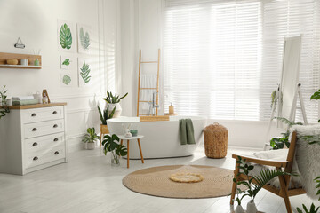 Stylish bathroom interior with green plants. Home design