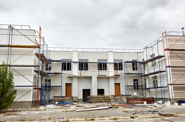 The progress of construction of the kindergarten building. Modern decoration of building facades