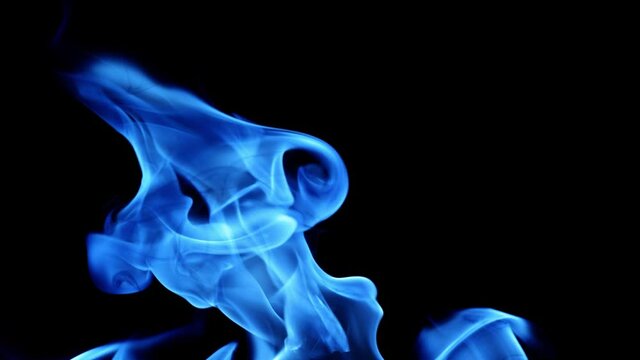 video with blue flame isolated on black background. Fire bright sparks slow motion