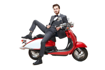 Fototapeta na wymiar elegant man on scooter