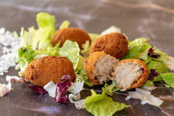 chicken croquette with salad leafs 