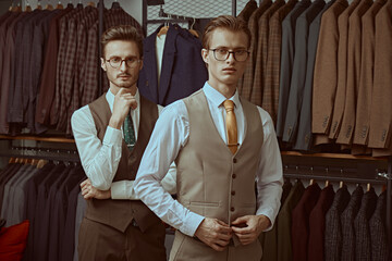 Fototapeta na wymiar two men in clothing store