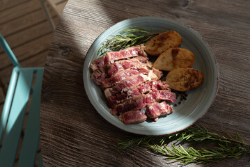 beef steak with potatoes on a plate