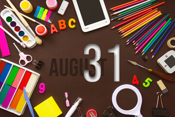 August 31st . Day 31 of month, Calendar date. School notebook and various stationery with calendar day. School and office supplies frame. Summer month, day of the year concept.