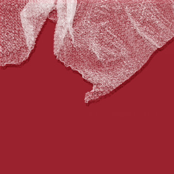 Bubble wrap against red background