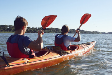 Cheerful couple paddling in kayak