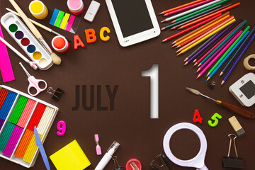 July 1st . Day 1 of month, Calendar date. School notebook and various stationery with calendar day. School and office supplies frame. Summer month, day of the year concept.