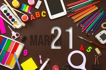 March 21st . Day 21 of month, Calendar date. School notebook and various stationery with calendar day. School and office supplies frame. Spring month, day of the year concept.
