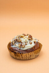 Cake with nuts on an orange background