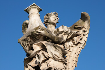 ROME, ITALY - SEPTEMBER 1, 2021: The Angel with the column on the Ponte Sant'Angelo by Antonio...