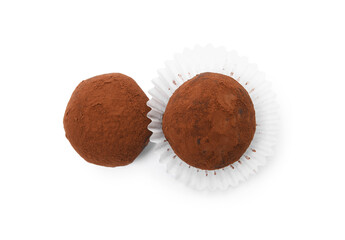 Delicious chocolate truffles powdered with cocoa on white background