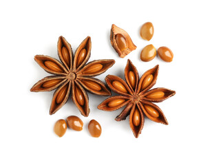 Dry anise stars with seeds on white background, top view