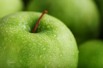 Background of ripe and juicy green apples, perspective from above.