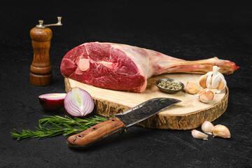 Raw lamb short cut leg, sirloin off on wooden stump