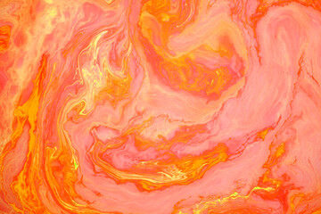 Orange abstract marble background, stains of red and yellow paint on the surface of the water. Liquid colorful backdrop.