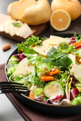 Delicious turnip salad served on grey table, closeup