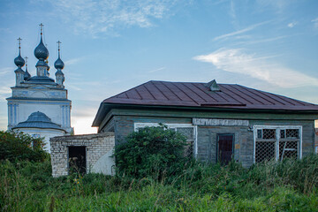 Village, church, old shop. thickets of grass.architecture, religion, building, russia, chapel, wooden, old, sky, orthodox, tree, tower, cross,