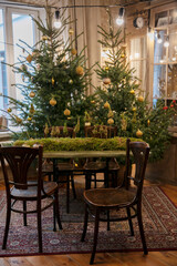 Christmas and New Year decorated interior room. Festive Xmas night with lights on tree with presents