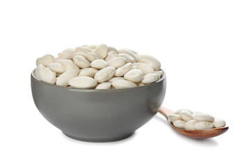 Spoon and bowl with uncooked navy beans on white background