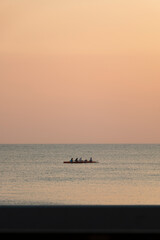 Fototapeta premium Couple friends canoeing on a canoe during a sunny day. a group of people enjoying. A group of people on canoe. 
