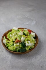 vegetable salad on a wooden plate