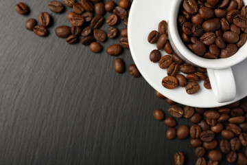 Cup and beans on black table, top view with space for text. Coffee Break