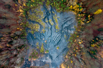 Remains of mining activity, earthenware area in the middle of the forest