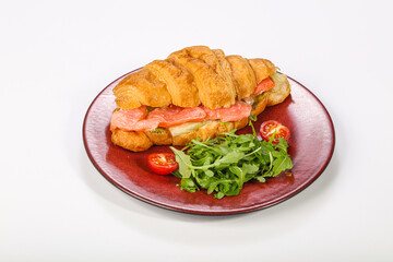Croissant with salmon for breakfast