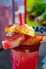 Closeup of a Traditional Aguas Frescas Beverage with Fruit Slices and Spices at the 2019 San Diego County Fair