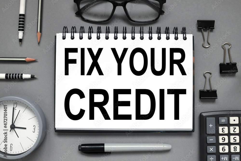 Poster fix your credit. open notepad with text on gray background
