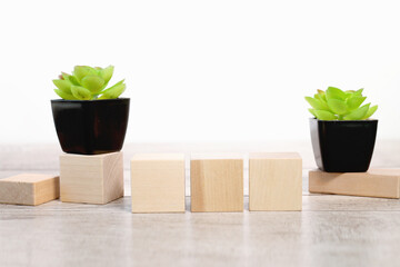Three blank wooden blocks over white background