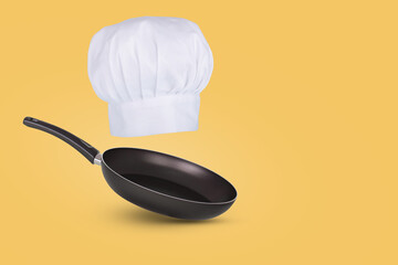 Chef hat floating in air isolated on a blue background. Creative business concept.