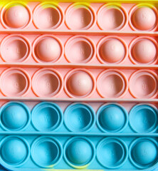 Pop it sensory toy from soft silicone bubbles. Stress and anxiety relief. Trendy game for stressed children and adults.