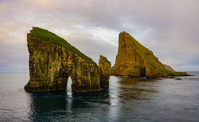 Europe, Faroe Islands. Aerial view of Drangarnir and Tindholmur off the coast of the island of Vagar.
