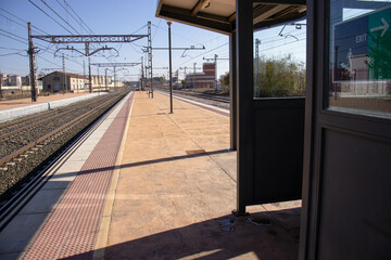Railroad station waiting platform, railroad platforms where trains travel to their destination. Concept train, railroad, wagons, tracks, rails.
