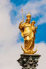 The golden Virgin Mary column in the Mariensaule main square, Munich, Bavaria, Germany.