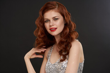 red-haired woman bright makeup glamor posing evening dresses