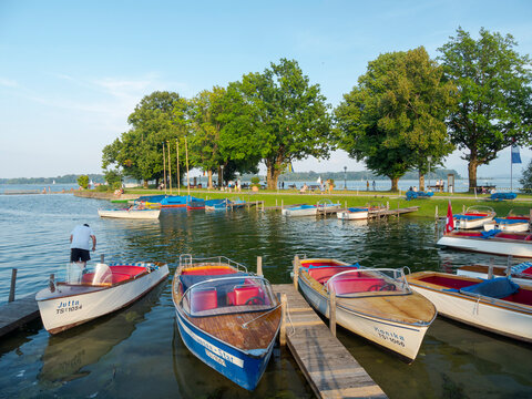 Harbor and lakeside promenade in Prien. Lake Chiemsee in the Chiemgau. The foothills of the Bavarian Alps in Upper Bavaria, Germany