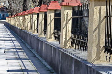 Fototapeta na wymiar Fences of Kanka rifle barrels that surround the Military Academy in Sofia, Bulgaria 