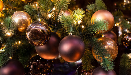 Obraz na płótnie Canvas Festive Christmas tree toys and the lights. 2022 holiday concept