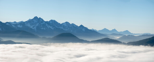 View from Mount Hoernle over a sea of fog hiding the valley of river Ammer towards Fuessen. Bavarian alps near Unterammergau in the Werdenfelser Land (Werdenfels county). Europe, Germany, Bavaria