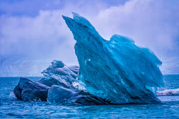Large iceberg Diamond Beach, Jokulsarlon glacier lagoon, Vatnajokull National Park, Iceland. Ice from Breidamerkurjokull Glacier