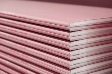 Stack of Plasterboard Fire Resistant gypsum. Drywall board cardboard surface Panel Type DF for...